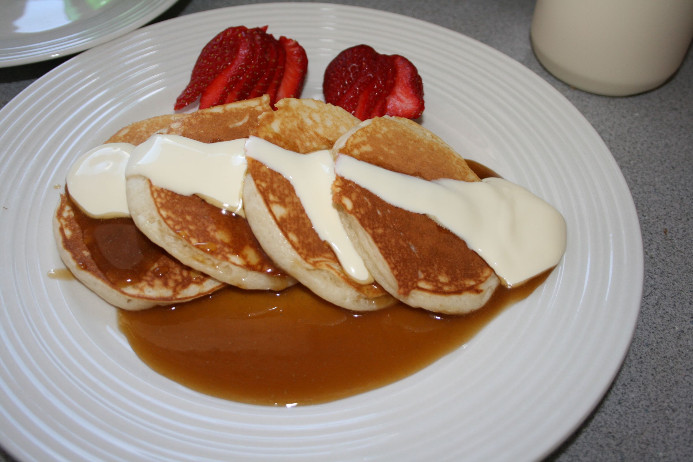 Buttermilk Pancakes With Caramel Sauce and Strawberries