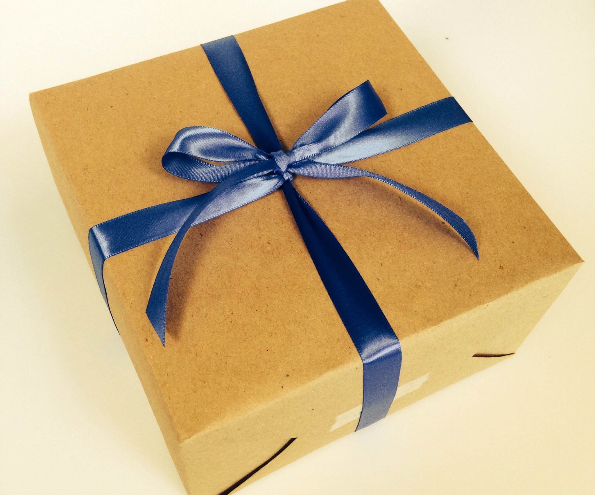 How to Gift Wrap (using 3 Pieces of Tape!)