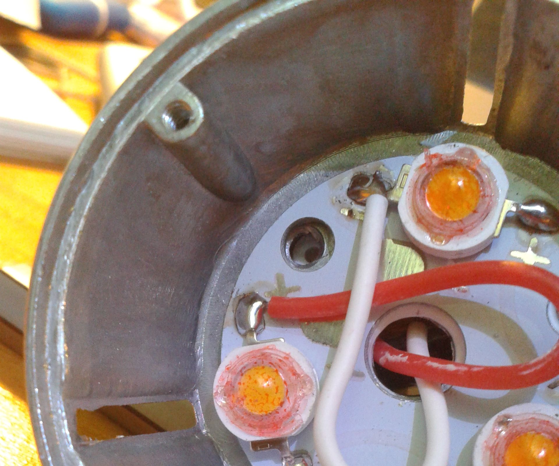 Making a "warm" white LED spotlight appear warmer 