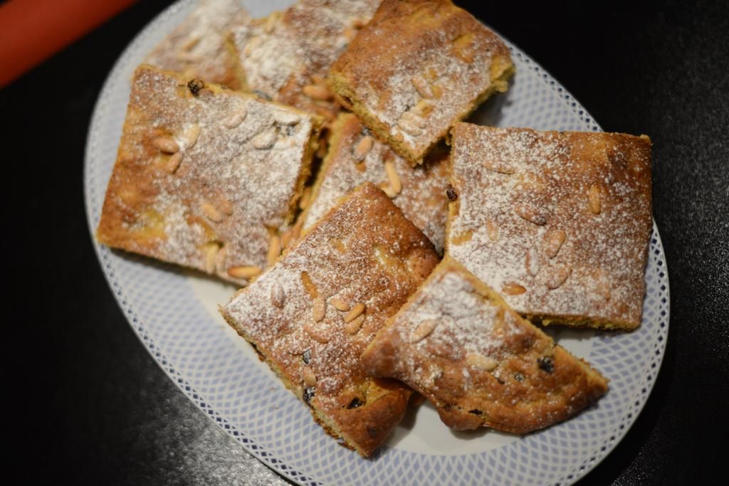 Sweet Focaccia With Raisin, Saffron, and Pine Seeds.
