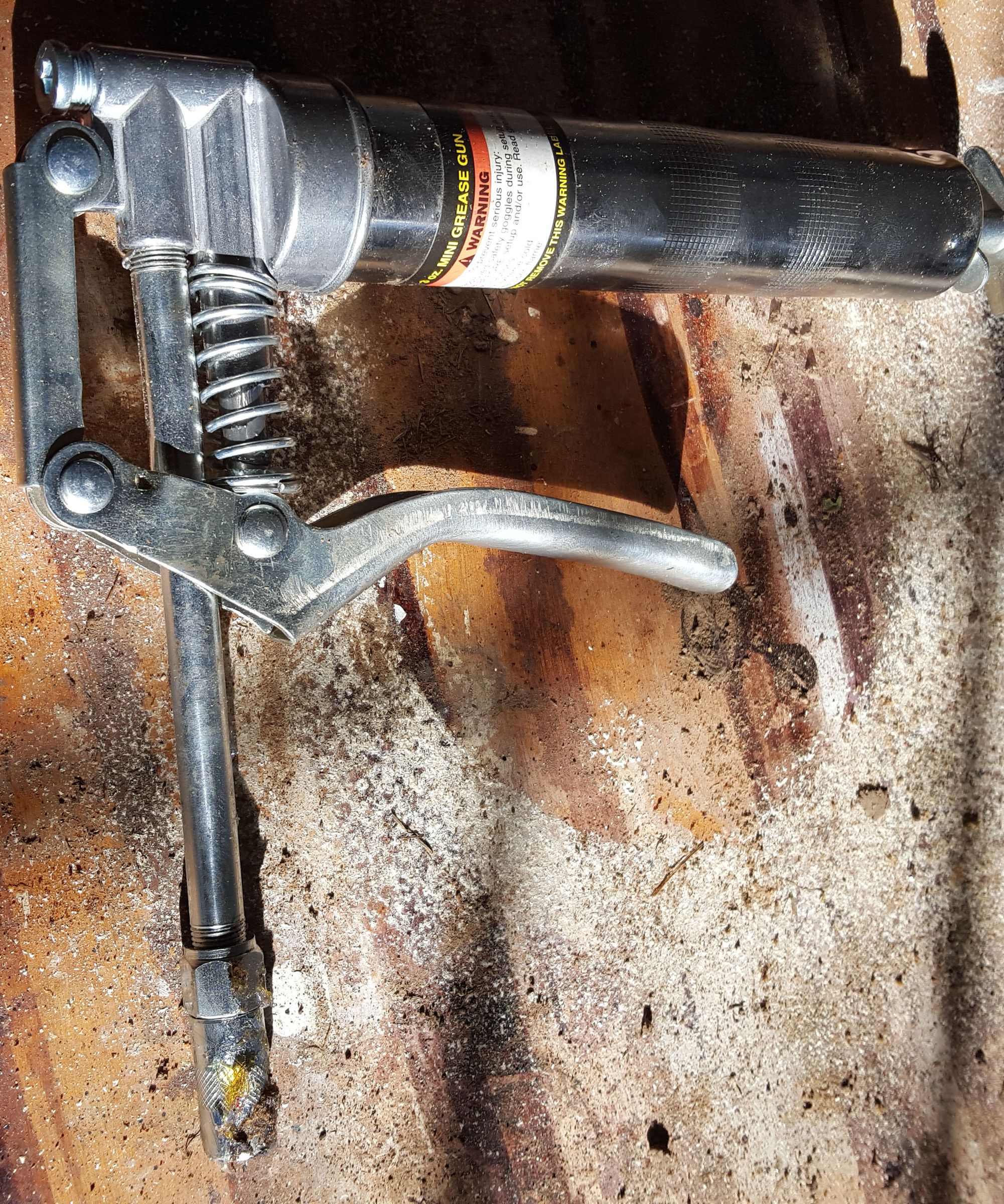 Storing a Grease Gun Without the Mess.
