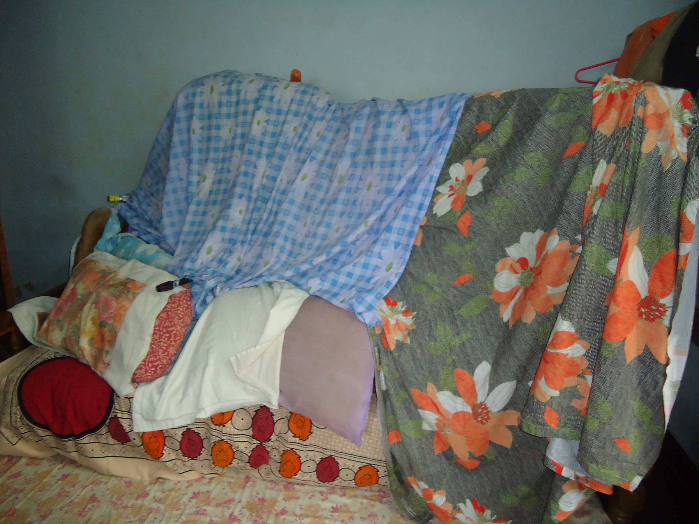 FORT MADE OF BED, COT, PILLOW AND SHEET
