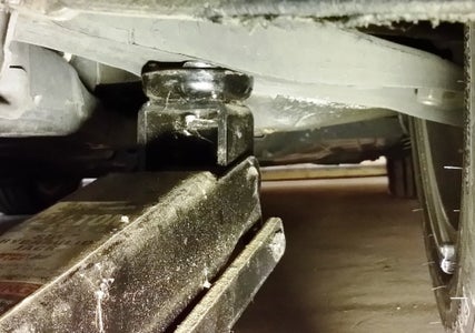 Loosen the Axle Nut and Jack Up the Car