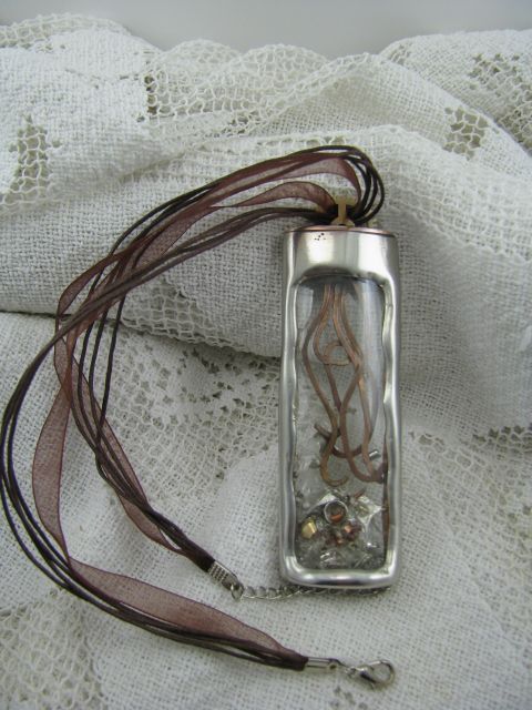 Steampunk pendant with tentacles and glass