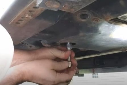 Drain Oil Into the Catch Pan