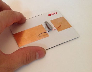 Glue the Pager Motor on the Back of Your Playing Card Panel