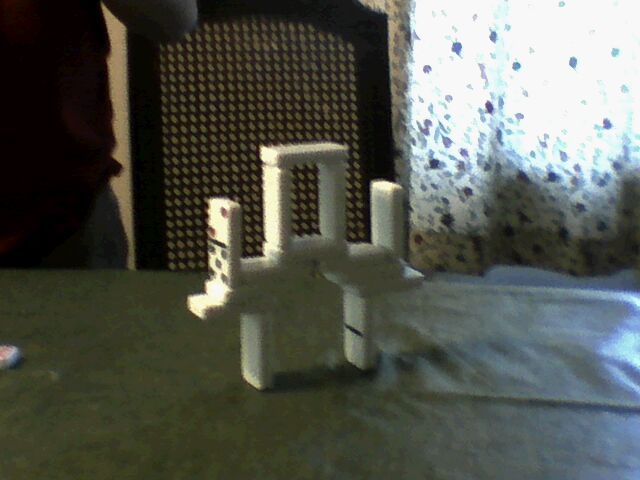 How to Make an Almost-Impossible Domino Bridge