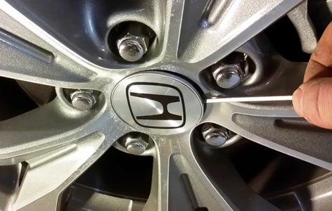 Loosen the Axle Nut and Jack Up the Car