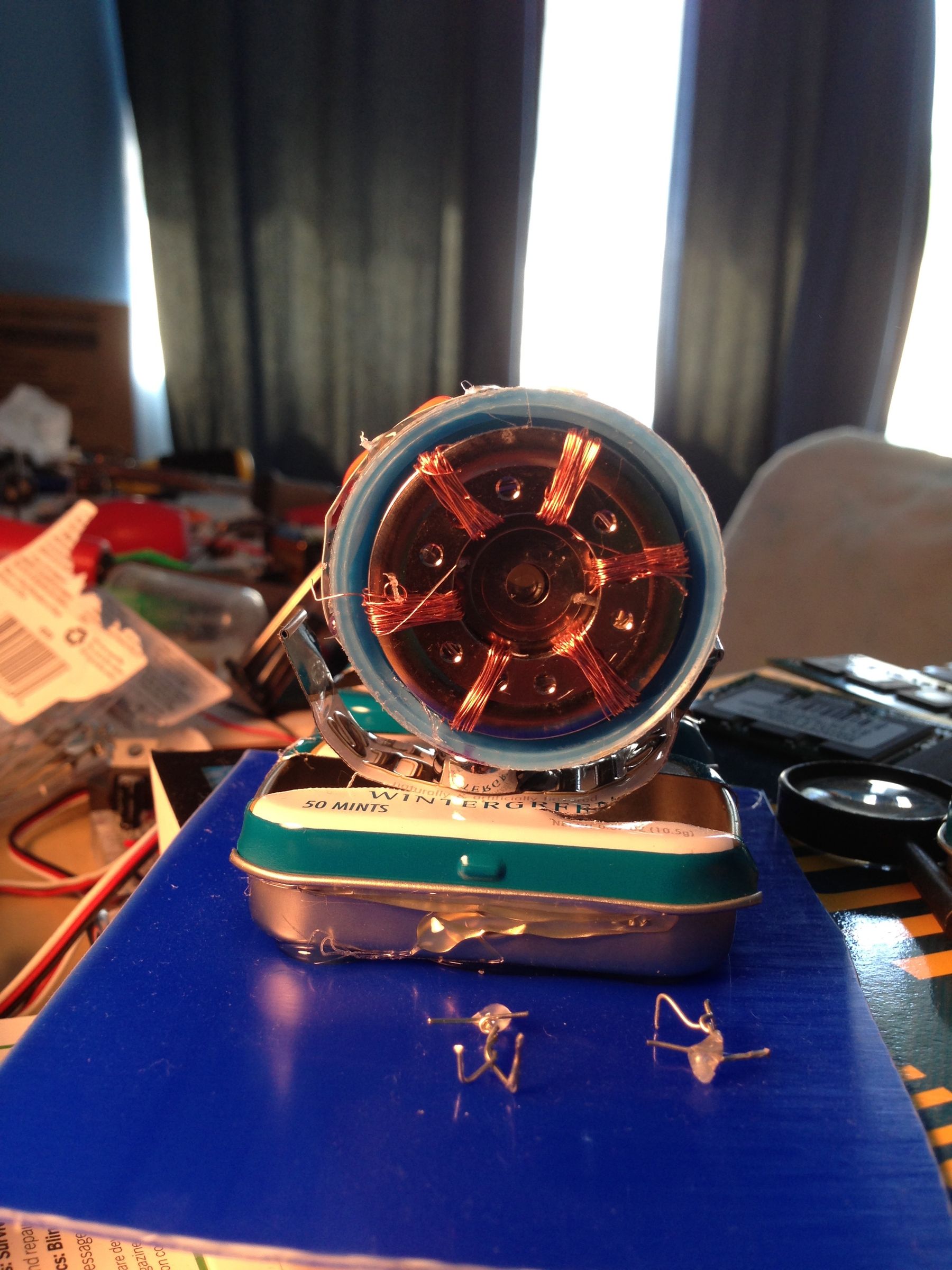 Micro Hadron Collider: A Miniature Model Particle Accelerator Made From Trash