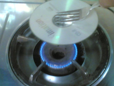 Carefully Heat the CD Into a Low Flame.