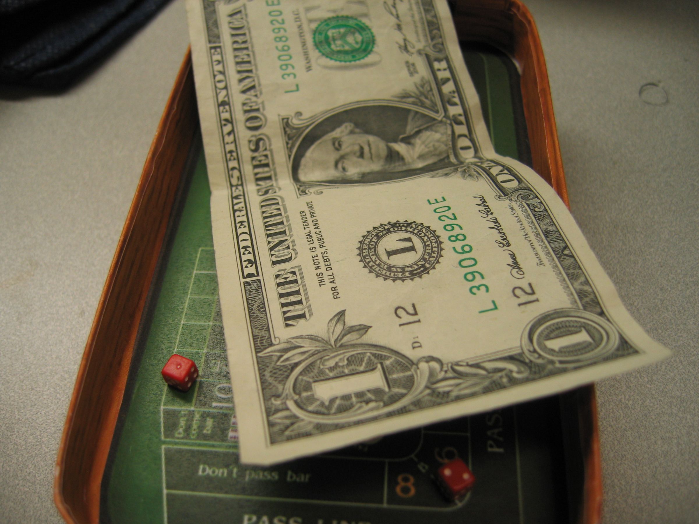 Make a tiny craps table out of stuff around the office.