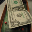 Make a tiny craps table out of stuff around the office.