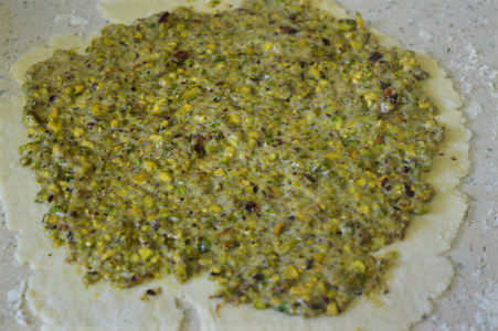 Divide the Filling Mixture Into Two and Spread a Layer of the Filling on the Entire Surface of the Rolled Out Dough.
