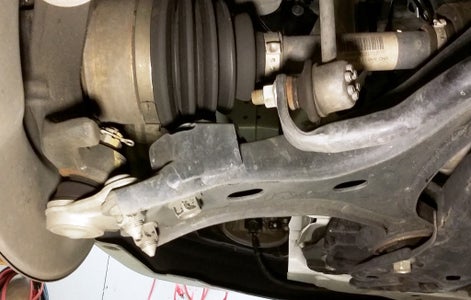 Drain Transmission, Disconnect Control Arms, and Remove Left Axle