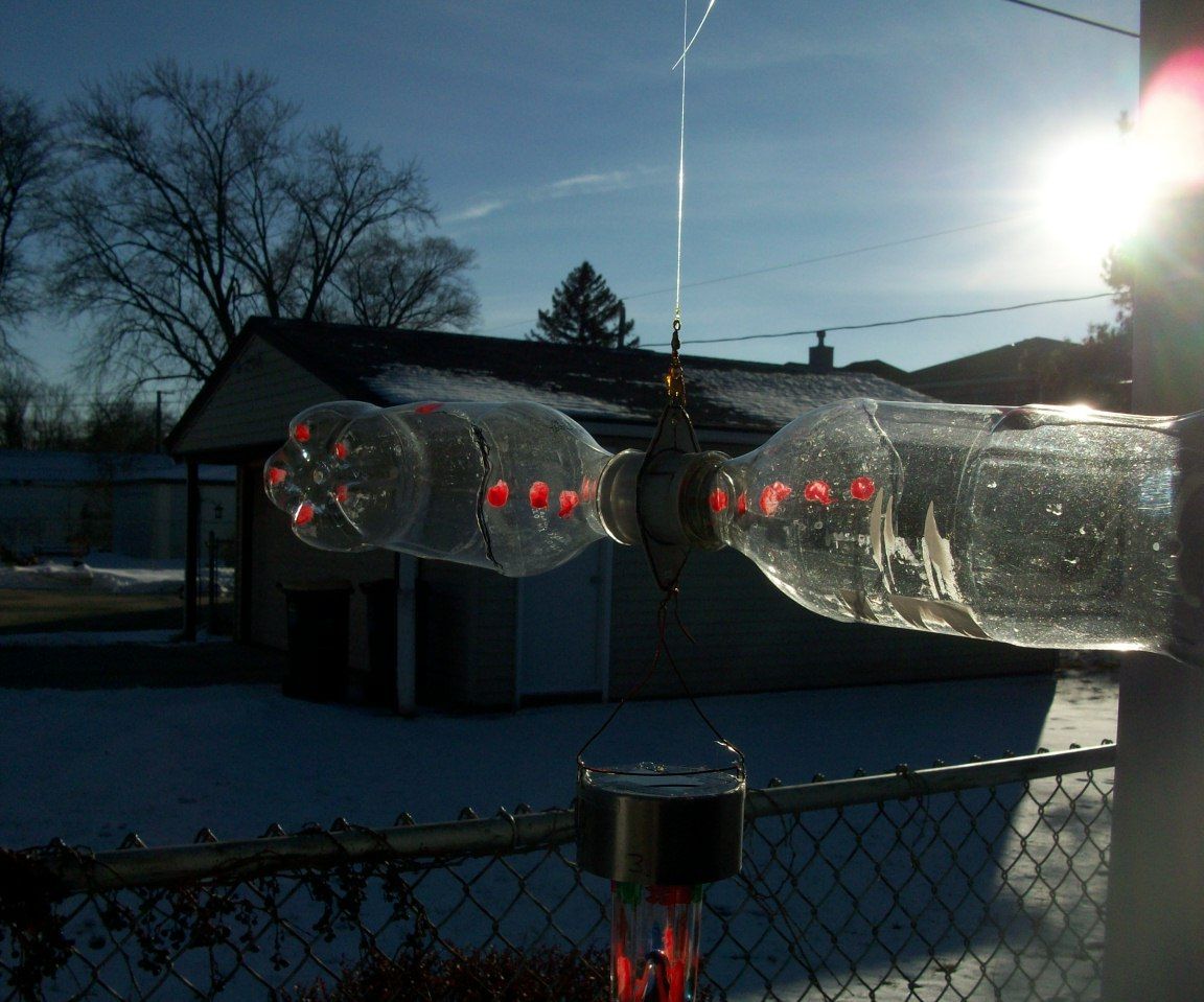 SUN AND WIND ENERGY CONVERTED WITH OLD RECYCLED JUNK