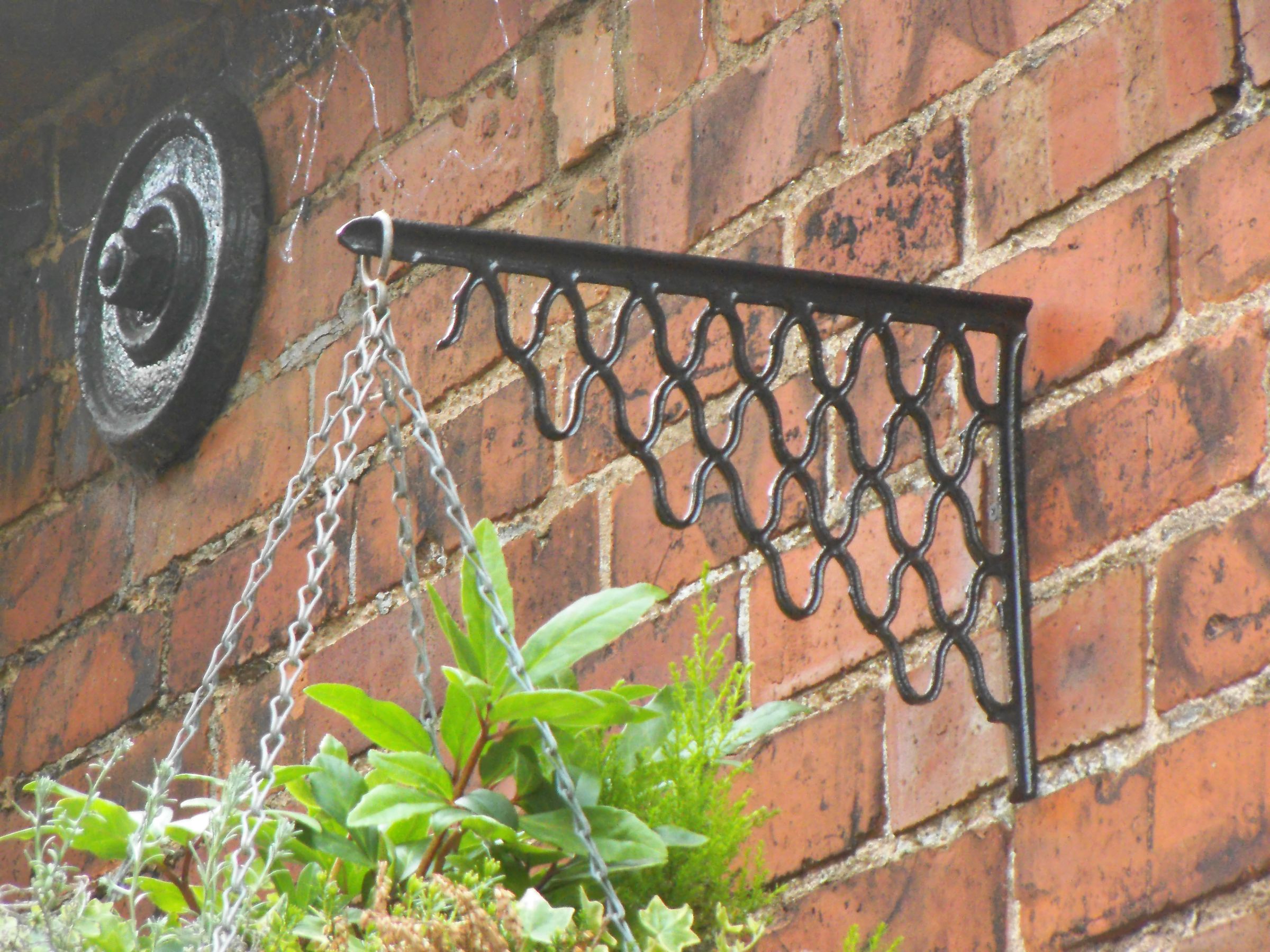 CAST IRON HANGING BASKET BRACKETS FROM OLD SEWING MACHINE TREADLE 3