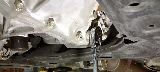Drain Transmission, Disconnect Control Arms, and Remove Left Axle