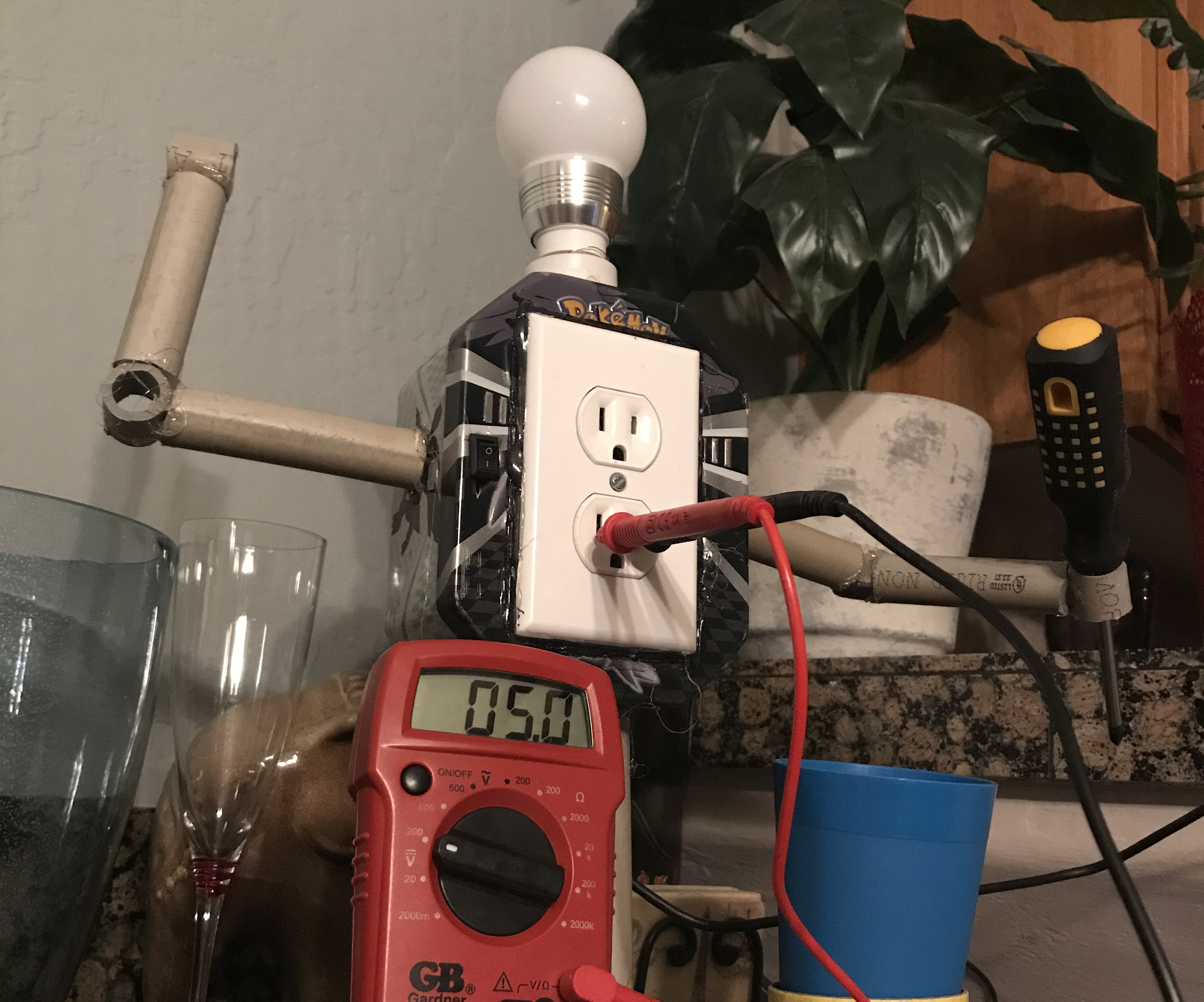 How to Make a Charging Station Robot From TRASH!!! BONUS: How to Make a Light Bulb Socket From Trash...