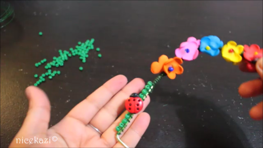 Wrapping the Swing With Flowers and Beads: