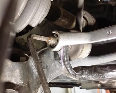 Replace the Left Axle and Reattach the Control Arms. 