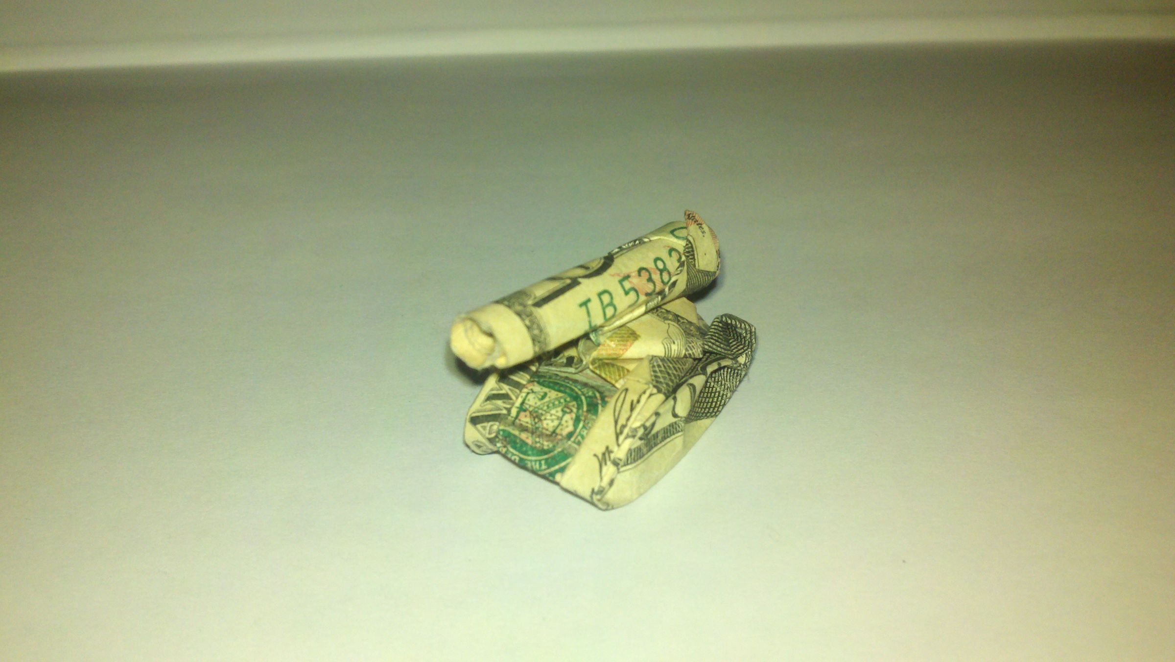 Folding a Paper Tank Out of a US Bill.