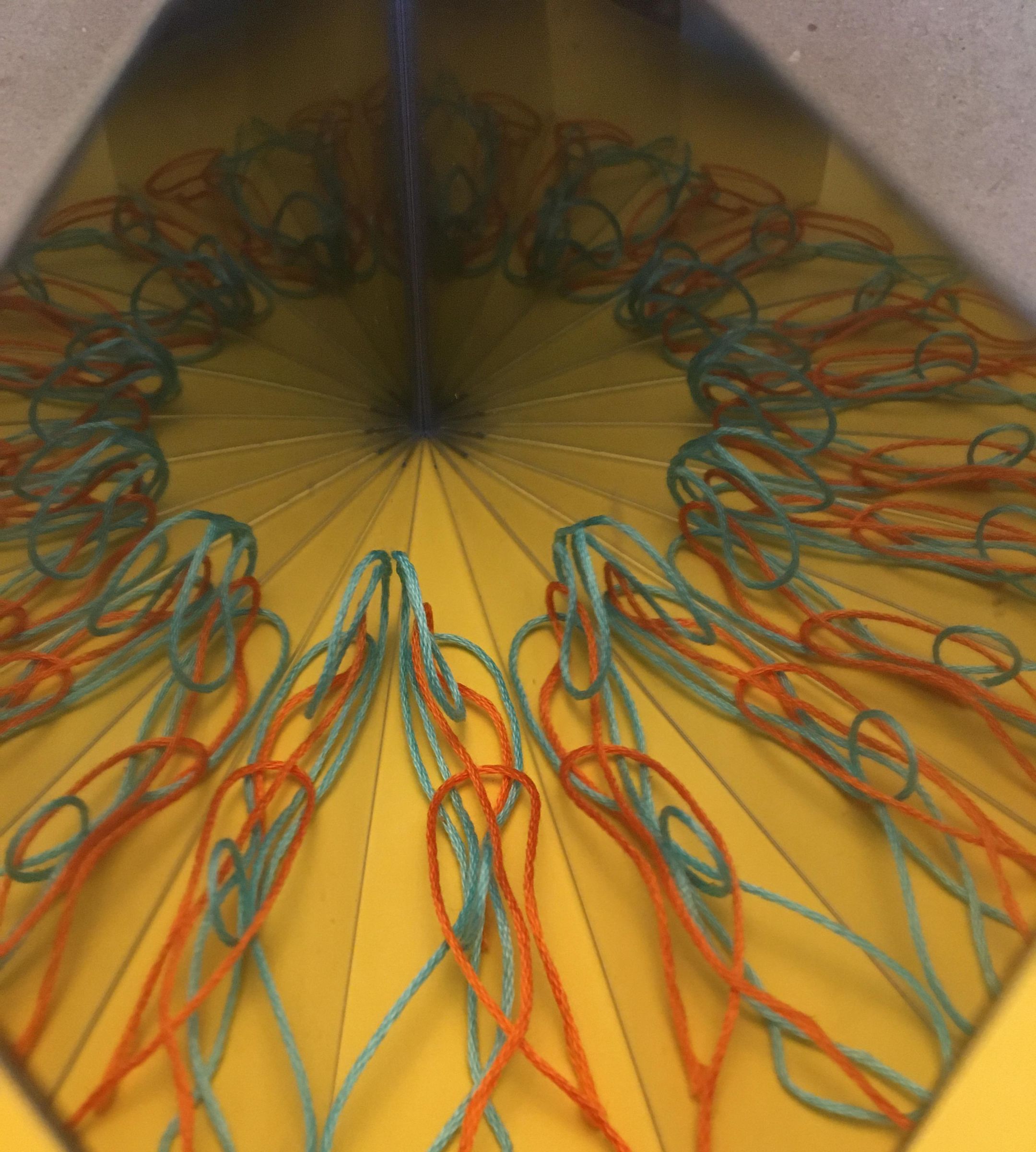 Mirrors, Paper Cutting, and Symmetry