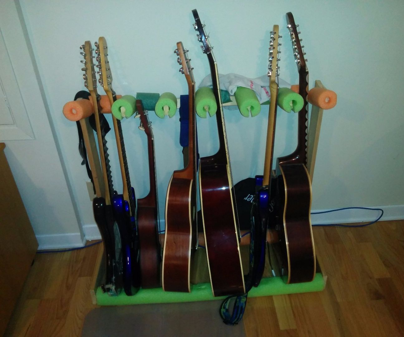 Guitar Stand From Pool Noodles and Discarded Wood