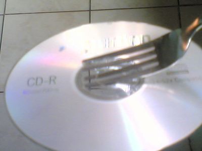 Position the Fork Into the CD.