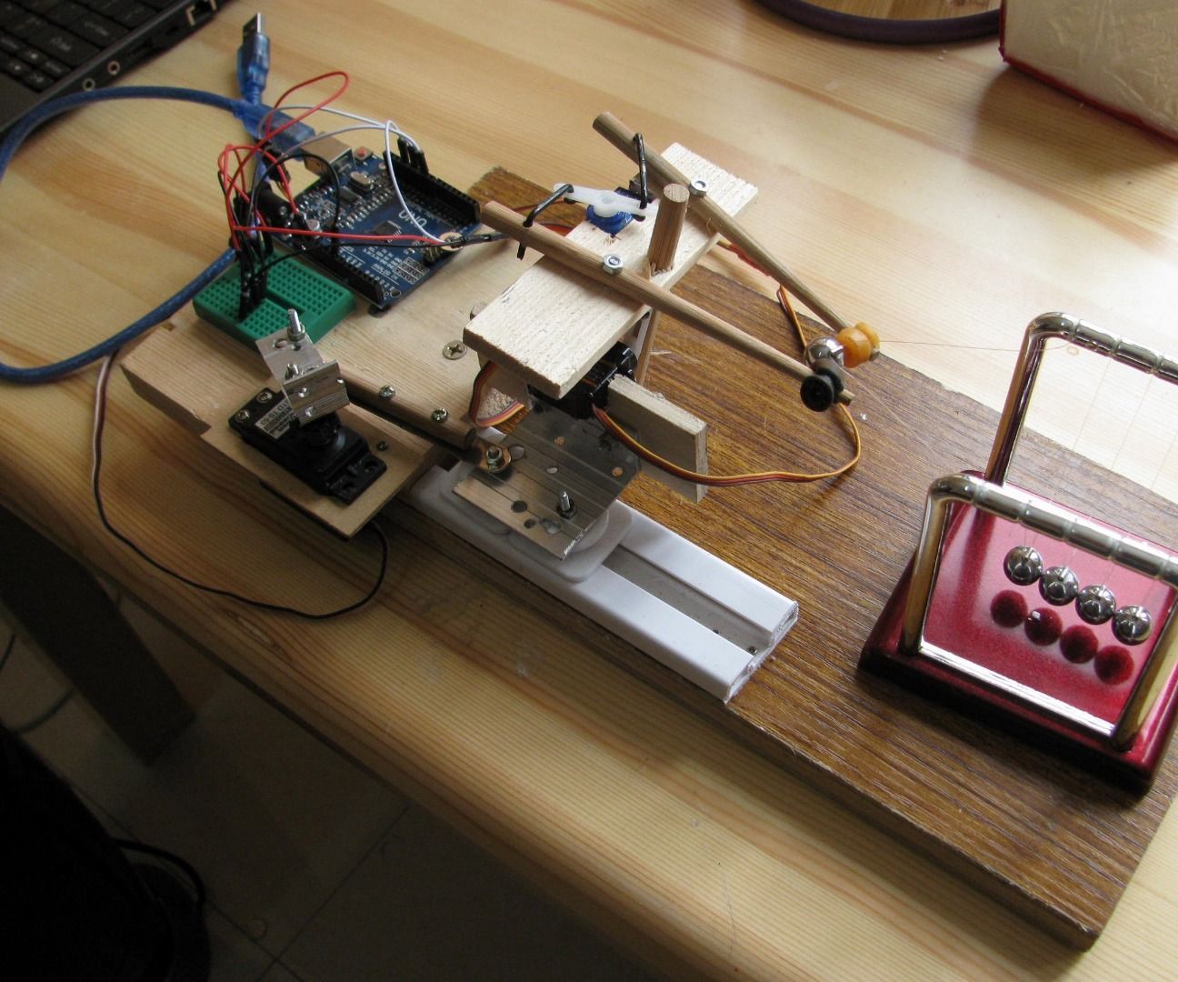 Robotic Newton's Cradle