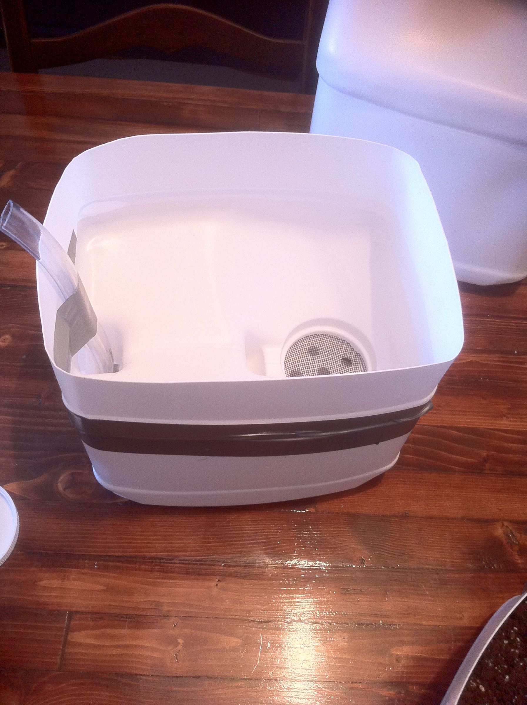 Self watering planter from cat litter container