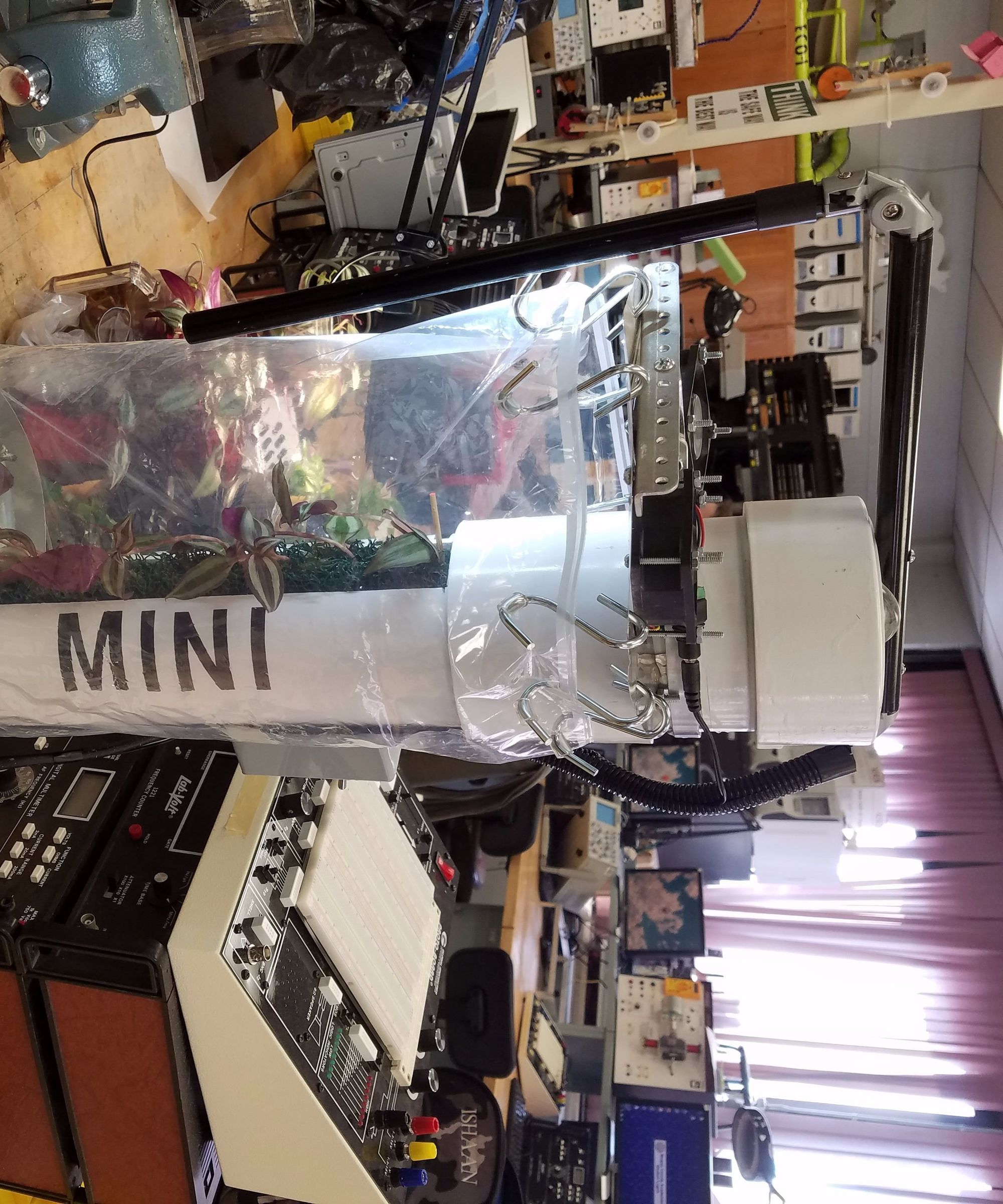 A Miniature Automated Greenhouse to Assist in Plant Development