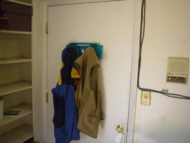Apple puck-mouse/keyboard coat rack