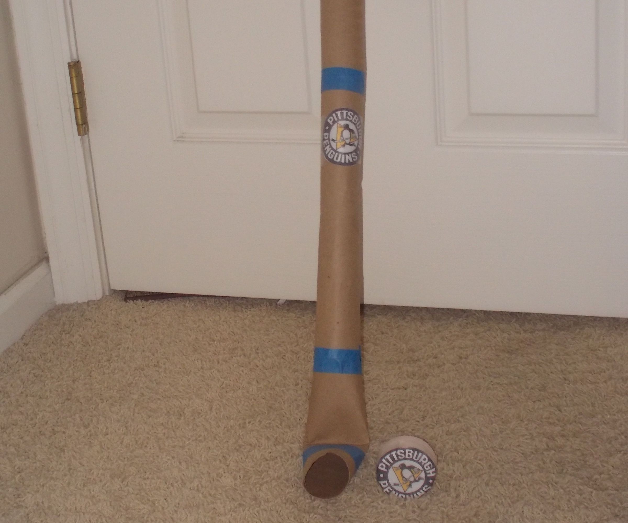 Hockey Stick and Puck From Paper Towel Rolls and Ketchup Lid
