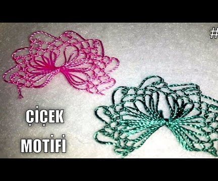            FLORAL MOTIF WITH NEEDLE