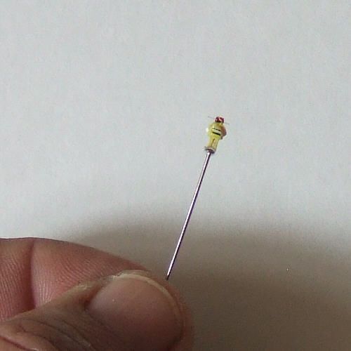Small Is Beautiful: Micro-Carving and Micro-Painting a Robot That Stands on the Head of a Pin.