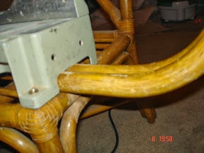 Mounting the Saw to the Chair With the Arms (outrollers) Positioned Under the Saw.