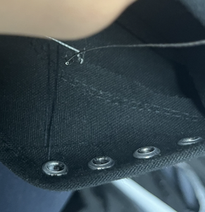 Sewing Flora Onto Each Shoe