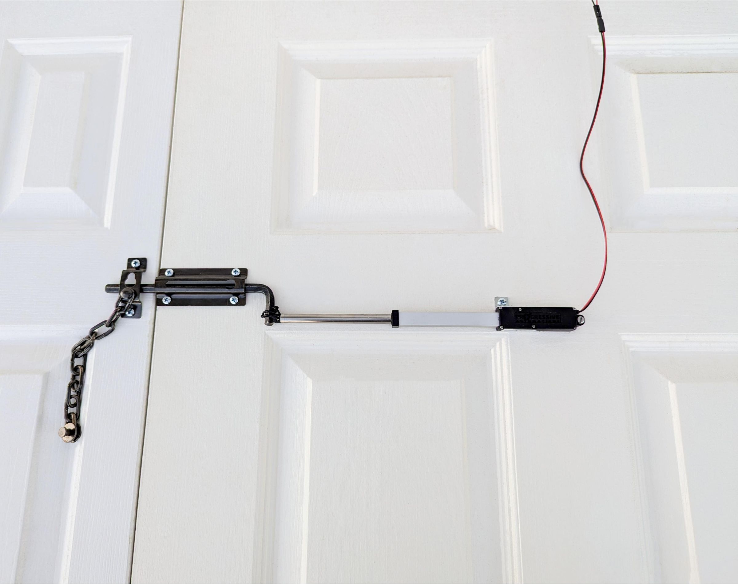 Sliding Bolt Latch Using PA-MC1 Micro Linear Actuators