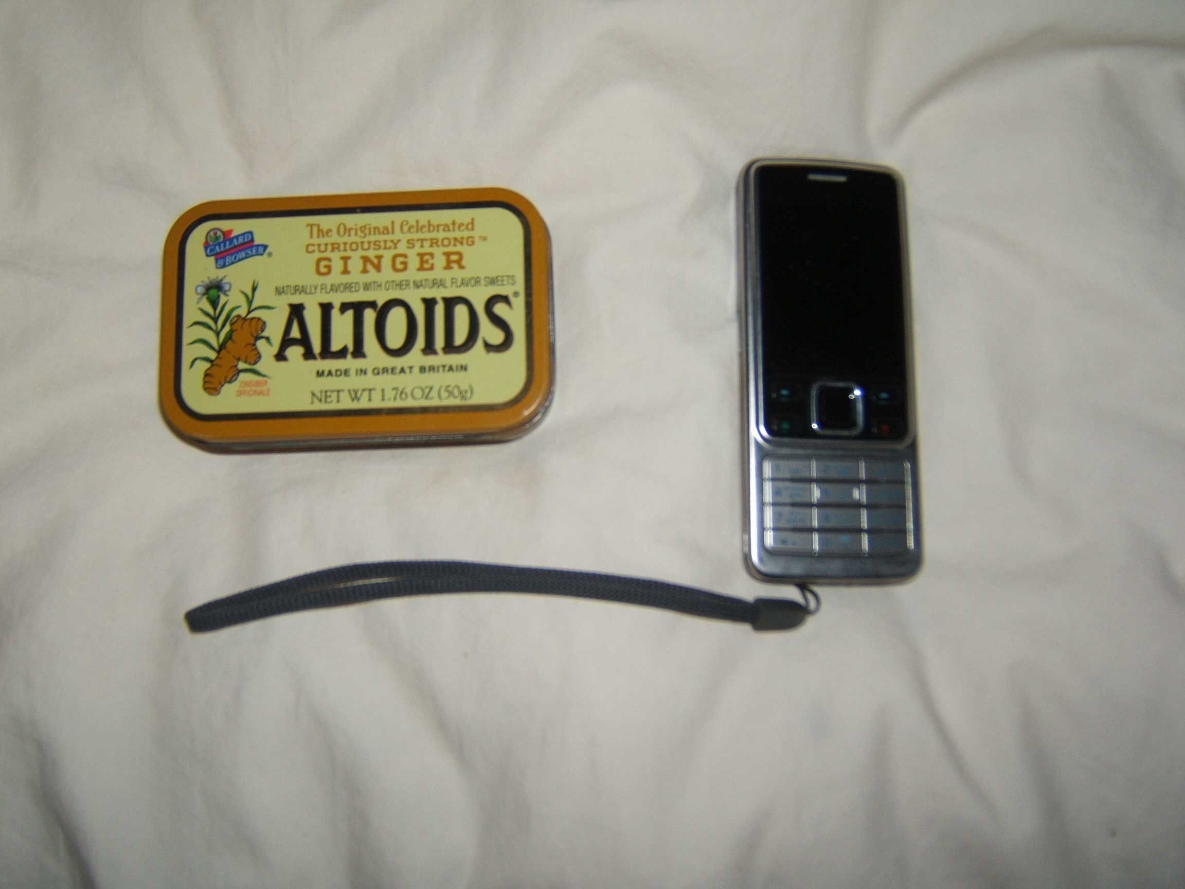 Solar Cell Phone Charger made from old parts and an...ALTOIDS TIN ... what else??