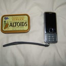 Solar Cell Phone Charger made from old parts and an...ALTOIDS TIN ... what else??