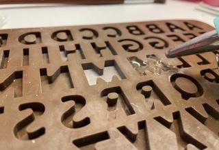 Pouring Hot Glue in the Moulds 