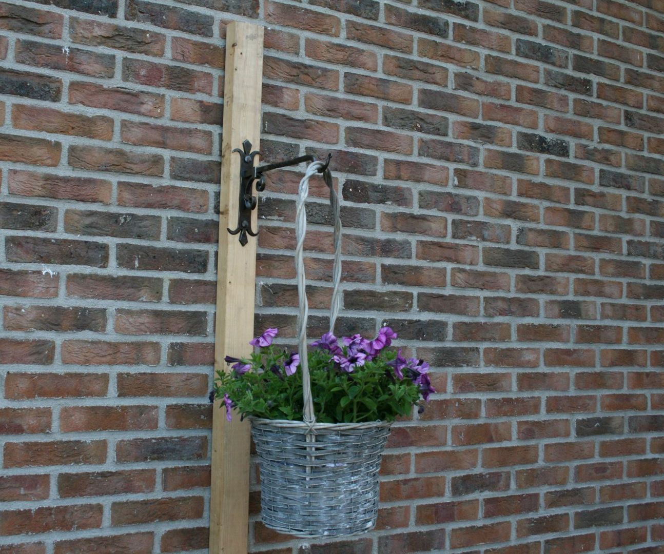 Forging a plant basket hanger of 3 railroad spikes