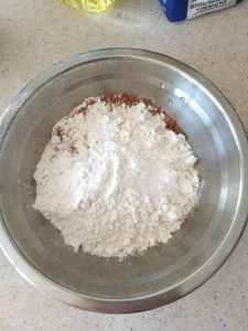 Add All the Dry Ingredients (cocoa, Flour, Baking Powder) Into a Bowl and Mix.