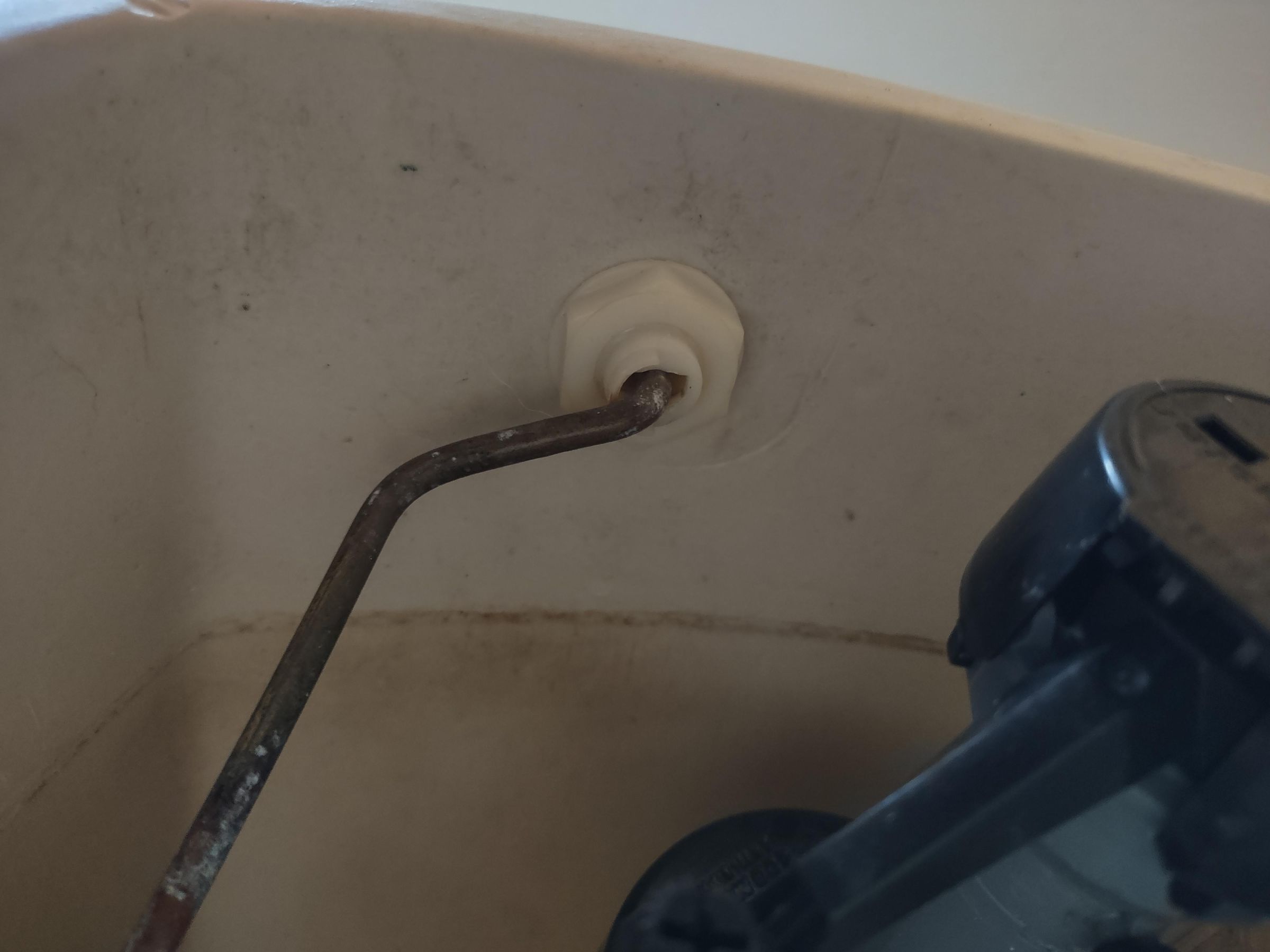 Fix a Toilet Tank Loose Handle, Discolored Water, and High Water Level