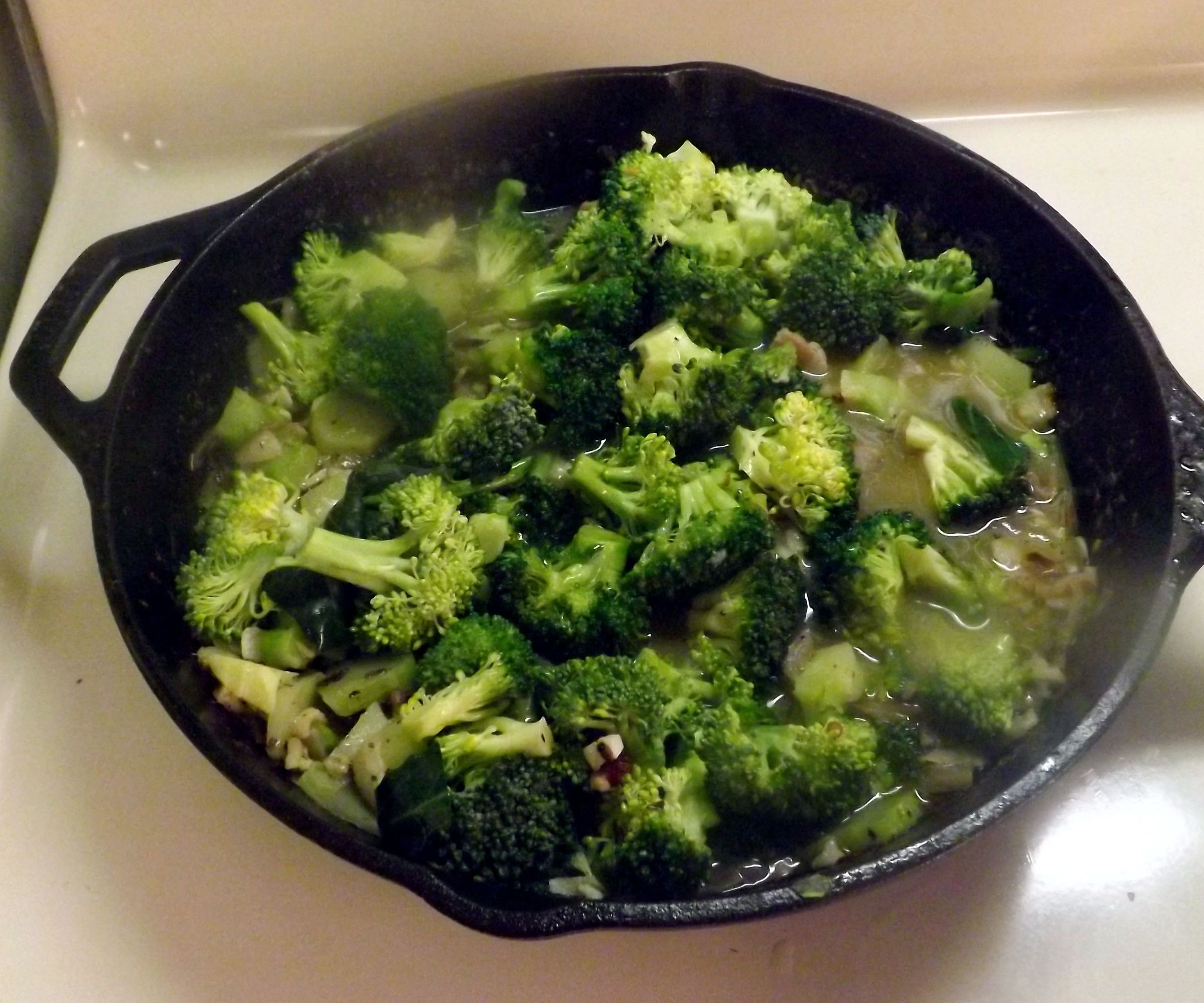 BROCCOLI SAUTEED IN a SAUCE OF GARLIC, ANCHOVIES, PARMESAN CHEESE & OLIVE OIL