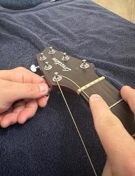 How to Restring a Guitar With a Pinless Bridge : 8 Steps - Instructables