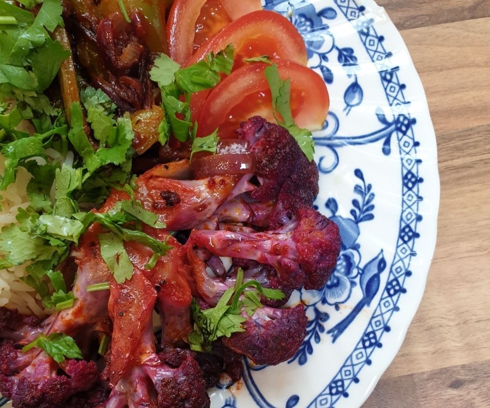 Cajun Purple Cauliflower Steaks With Onions and Peppers