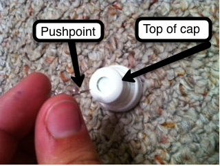 Using a Pushpin to Make Holes in Water Bottle Top