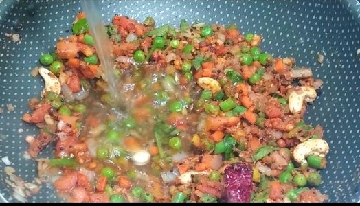 Adding Water Cooking and Serving Khara Bath. 