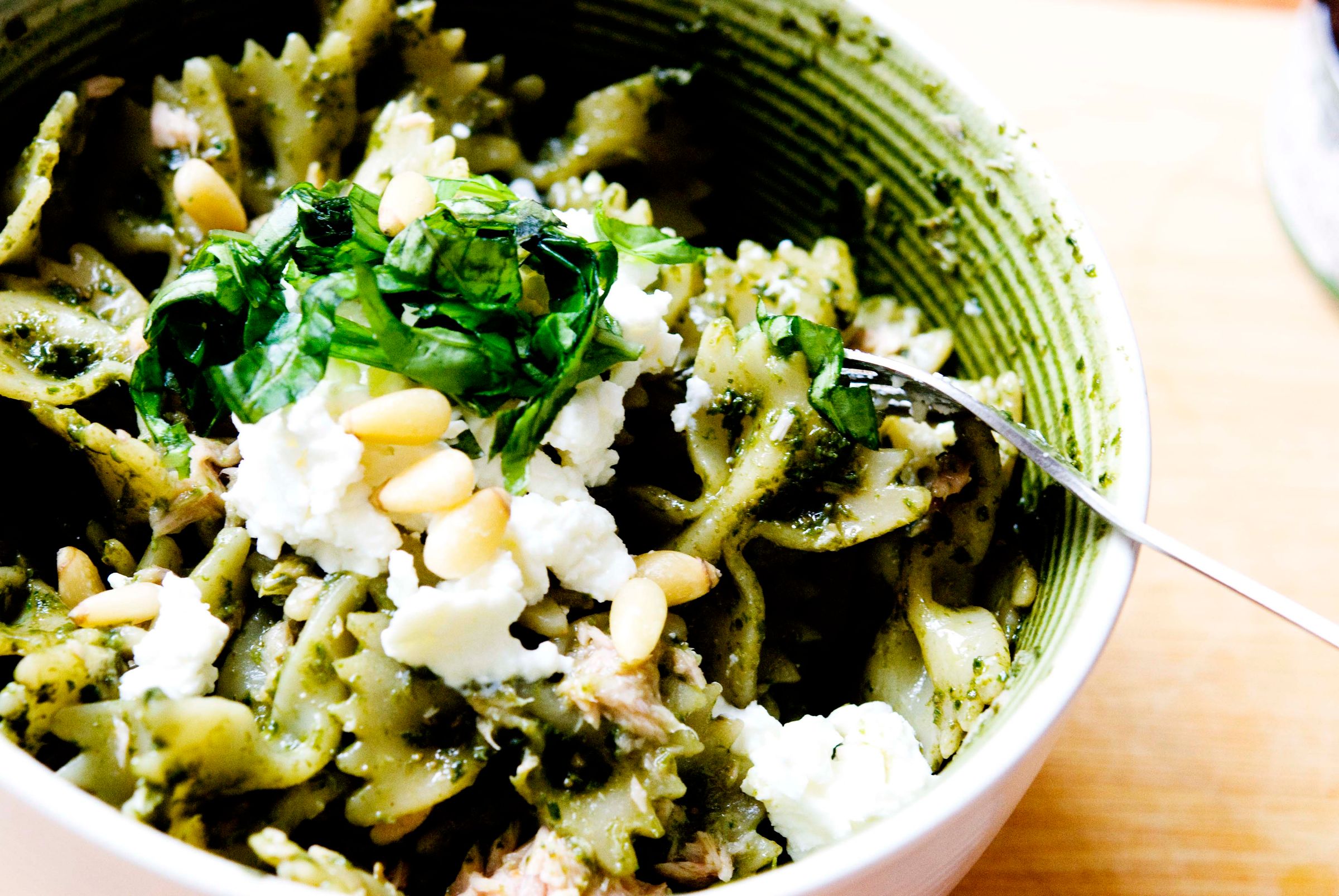 Basil pesto pasta with tuna and pine nuts